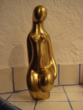 
													Femme nue en bronze doré
												