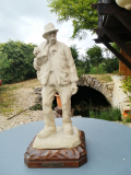 
													Sculpture grès E. Wittman paysan avec sac sur le dod
												