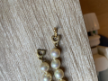 
													Collier de perles Dior
												