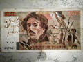 
															billet de 100 francs dédicacé par Serge Gainsbourg , et aussi une pastel de mr Claude Nougaro
														