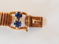 
															Bracelet or jaune et saphirs griffés Boucheron
														