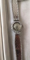 
															Montre femme sibex or blanc et pierres
														