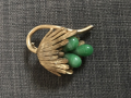 
															Broche en or et jade vert
														