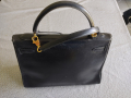 
															Sac Kelly cuir noir
														