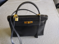 
															Sac Kelly cuir noir
														