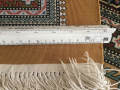 
															Tapis persan en soie tissé dans la province de Ghom
														