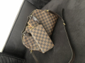 
															Sac et portefeuille Louis Vuitton
														