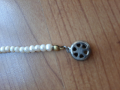 
															collier de perles véritables année 1920
														