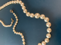 
															Collier de perles
														