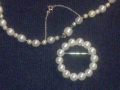 
															Collier de perles
														